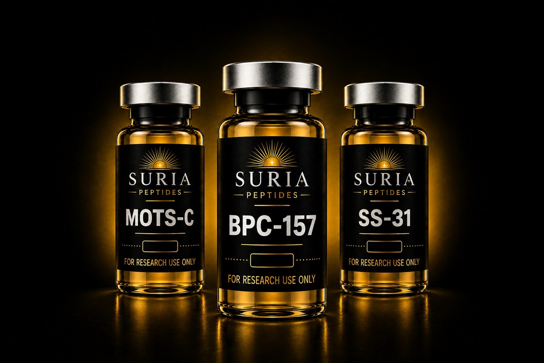 Three Suria Peptides research vials with silver caps and amber glass, labeled BPC-157, MOTS-C, and SS-31, lit against a dark background with warm gold ambient light